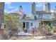 Exterior view of backyard with patio, string lights, and view of the back of the townhomes at 8 Townpark Ln # B, Charleston, SC 29412