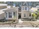 Charming home with a well-maintained yard and a small balcony above the doorway at 8 Townpark Ln # B, Charleston, SC 29412
