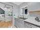 Charming kitchen features stone countertops, stainless steel appliances, and backyard views at 8 Townpark Ln # B, Charleston, SC 29412