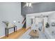 Spacious living room with vaulted ceilings, hardwood floors, and staircase to the second level at 8 Townpark Ln # B, Charleston, SC 29412