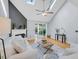 Cozy living room with vaulted ceilings, fireplace, hardwood floors, and backyard access at 8 Townpark Ln # B, Charleston, SC 29412