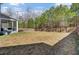Spacious backyard with a wood privacy fence, lush lawn, and a screened-in porch at 808 S Pointe Blvd, Summerville, SC 29483