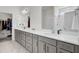 Bathroom featuring dual sinks, gray cabinetry, white countertops, and a large walk-in closet at 808 S Pointe Blvd, Summerville, SC 29483