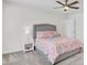 Bright bedroom with plush carpeting, a ceiling fan, and a colorful bedspread at 808 S Pointe Blvd, Summerville, SC 29483