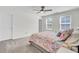 Cozy bedroom with plush carpeting, a ceiling fan, and large windows for natural light at 808 S Pointe Blvd, Summerville, SC 29483