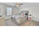 Bedroom features a gray upholstered bed, ceiling fan and window, and dresser at 808 S Pointe Blvd, Summerville, SC 29483