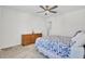 Bright bedroom features a ceiling fan, a dresser, and bed with patterned comforter at 808 S Pointe Blvd, Summerville, SC 29483