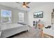 Bedroom with two windows, ceiling fan, bed, and TV mounted on the wall at 808 S Pointe Blvd, Summerville, SC 29483