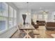 Open-concept dining and living room area with hardwood floors and lots of natural light at 808 S Pointe Blvd, Summerville, SC 29483