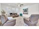 Spacious living room with an electric fireplace, plenty of seating, and natural light at 808 S Pointe Blvd, Summerville, SC 29483