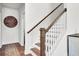 A beautiful staircase with hardwood steps, white risers, and a wooden handrail at 808 S Pointe Blvd, Summerville, SC 29483