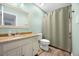 Bathroom featuring a vanity with marble counter top, mirror, toilet, shower, and modern fixtures at 8618 Grassy Oak Trl, North Charleston, SC 29420