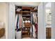 Organized walk-in closet featuring custom shelving and ample storage space for clothes, shoes, and accessories at 8618 Grassy Oak Trl, North Charleston, SC 29420