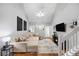 Bright living room with vaulted ceiling, a comfortable sofa, and access to the backyard at 8618 Grassy Oak Trl, North Charleston, SC 29420