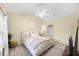Inviting bedroom featuring a ceiling fan, a large bed, and a neutral color scheme at 8618 Grassy Oak Trl, North Charleston, SC 29420