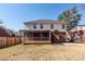 Exterior showcasing a backyard with a screened porch and patio, perfect for outdoor living at 8745 Alexandria Dr, North Charleston, SC 29420