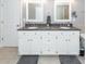Bathroom featuring a large white double vanity with grey granite countertops at 8745 Alexandria Dr, North Charleston, SC 29420