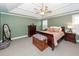 Charming bedroom featuring a coffered ceiling, fan, and sage colored walls at 8745 Alexandria Dr, North Charleston, SC 29420