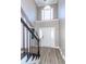 Elegant foyer with high ceilings, large windows, and hardwood floors at 8745 Alexandria Dr, North Charleston, SC 29420