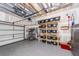 Spacious garage featuring built-in storage shelves and epoxy flooring for easy maintenance at 8745 Alexandria Dr, North Charleston, SC 29420