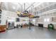 Organized garage with overhead storage and epoxy floors, maximizing space and functionality at 8745 Alexandria Dr, North Charleston, SC 29420