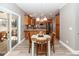 Eat-in kitchen featuring wood cabinets, granite countertops, stainless appliances, and natural light at 8745 Alexandria Dr, North Charleston, SC 29420