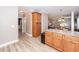 Open kitchen featuring wood cabinets, granite countertops, and natural light at 8745 Alexandria Dr, North Charleston, SC 29420