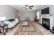Inviting living room with wood-look floors, fireplace, and a comfortable seating area at 8745 Alexandria Dr, North Charleston, SC 29420