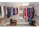 Organized walk-in closet featuring ample shelving and hanging space for clothes and shoes at 8745 Alexandria Dr, North Charleston, SC 29420