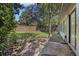 View of a fenced backyard with a concrete patio and side of the house at 9 Stallion Ct, Charleston, SC 29407