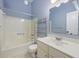 Blue bathroom featuring a shower-tub combination, toilet, and vanity with sink at 9 Stallion Ct, Charleston, SC 29407