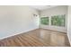 Bedroom with hardwood floors and windows letting in lots of natural light at 9 Stallion Ct, Charleston, SC 29407