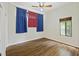 Bedroom with wood floors, ceiling fan, and windows with curtains letting in natural light at 9 Stallion Ct, Charleston, SC 29407