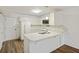 Bright kitchen featuring white appliances, countertop, and ample cabinet space at 9 Stallion Ct, Charleston, SC 29407