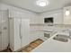 Bright kitchen featuring white appliances, countertop, and ample cabinet space at 9 Stallion Ct, Charleston, SC 29407