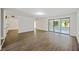 Bright living room featuring wood floors and sliding glass doors to outside patio at 9 Stallion Ct, Charleston, SC 29407
