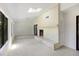 Spacious living room boasts a brick fireplace, tile flooring, and large windows for plenty of natural light at 9 Stallion Ct, Charleston, SC 29407