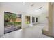Open living space featuring tile flooring, a brick fireplace, and sliding doors to the outdoor patio and backyard at 9 Stallion Ct, Charleston, SC 29407