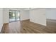 Bright living room with hardwood floors and sliding glass door to back patio at 9 Stallion Ct, Charleston, SC 29407