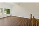 Bright living room with wood floors, vaulted ceilings, and windows offering natural light at 9 Stallion Ct, Charleston, SC 29407