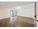 Open living room showing wood floors and access to an outside patio at 9 Stallion Ct, Charleston, SC 29407