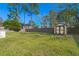A well-kept backyard featuring a storage shed, enclosed by a traditional wooden fence at 100 Traders Station Rd, Summerville, SC 29486