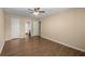 A generously sized bedroom with wood flooring and a ceiling fan is conveniently situated near the bathroom at 100 Traders Station Rd, Summerville, SC 29486