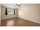 This bedroom boasts ample space, a ceiling fan, and natural light streaming in from the window at 100 Traders Station Rd, Summerville, SC 29486