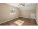 This bedroom offers natural light through a window and hardwood floors at 100 Traders Station Rd, Summerville, SC 29486