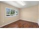 A bedroom featuring laminate flooring and a large window at 100 Traders Station Rd, Summerville, SC 29486