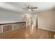 The open living space features wood-look floors and stone accents on the stairway wall at 100 Traders Station Rd, Summerville, SC 29486