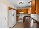 A kitchen featuring wooden cabinets, tile flooring, and white appliances at 100 Traders Station Rd, Summerville, SC 29486
