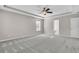 Bedroom with tray ceiling, carpet, and entry to bathroom and closet at 105 Endicott Ct, Summerville, SC 29486