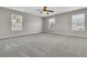 Spacious bedroom with three windows offering great natural light and a ceiling fan at 105 Endicott Ct, Summerville, SC 29486